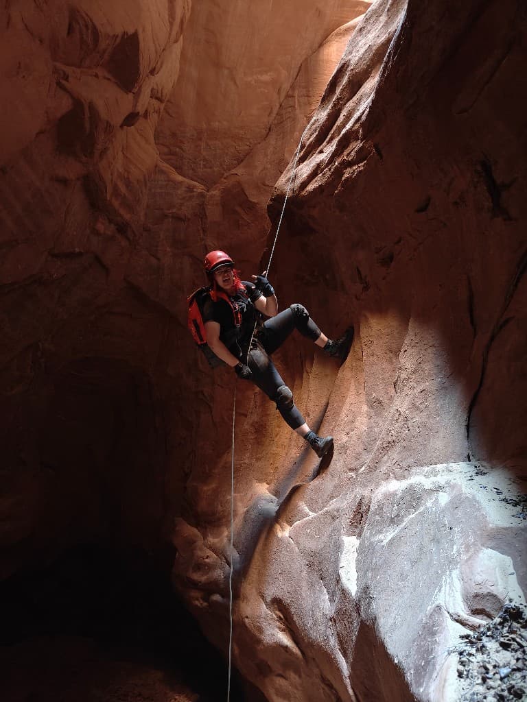 Rappelling through a slot canyon