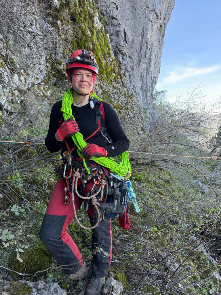 Technical climbing on a limestone cliff with rescue rope